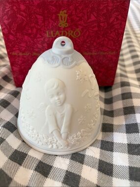 Lladró White Porcelain Bell Ornament with Embossed Child Motif